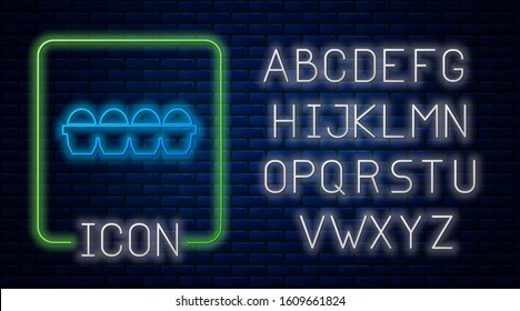 Glowing neon Chicken egg in box icon isolated on brick wall background. Neon light alphabet. Vector Illustration