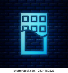 Glowing neon Chocolate bar icon isolated on brick wall background.  Vector