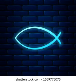 Glowing neon Christian fish symbol icon isolated on brick wall background. Jesus fish symbol.  Vector Illustration