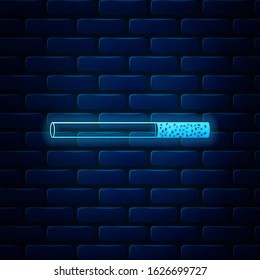 Glowing neon Cigarette icon isolated on brick wall background. Tobacco sign. Smoking symbol.  Vector Illustration