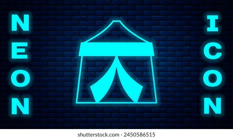 Glowing neon Circus tent icon isolated on brick wall background. Carnival camping tent. Amusement park.  Vector