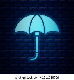 Glowing neon Classic elegant opened umbrella icon isolated on brick wall background. Rain protection symbol.  Vector Illustration