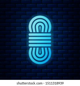 Glowing neon Climber rope icon isolated on brick wall background. Extreme sport. Sport equipment.  Vector Illustration