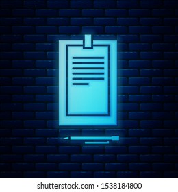 Glowing neon Clipboard with document icon isolated on brick wall background.  Vector Illustration