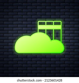Glowing neon Cloud or online library icon isolated on brick wall background. Internet education or distance training.  Vector