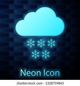 Glowing neon Cloud with snow icon isolated on brick wall background. Cloud with snowflakes. Single weather icon. Snowing sign. Vector Illustration