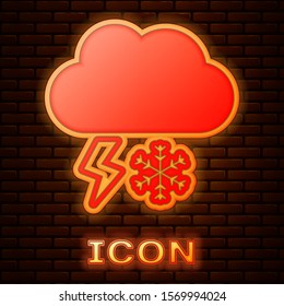 Glowing neon Cloud with snow and lightning icon isolated on brick wall background. Cloud with snowflakes. Single weather icon. Snowing sign.  Vector Illustration