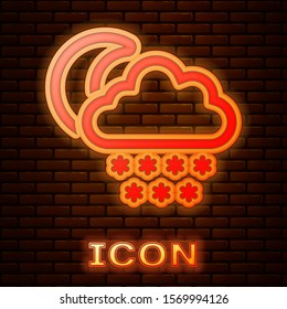 Glowing neon Cloud with snow and moon icon isolated on brick wall background. Cloud with snowflakes. Single weather icon. Snowing sign.  Vector Illustration