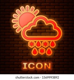 Glowing neon Cloud with snow, rain and sun icon isolated on brick wall background. Weather icon.  Vector Illustration