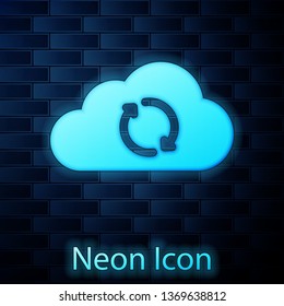 Glowing neon Cloud sync refresh icon isolated on brick wall background. Cloud and arrows. Vector Illustration