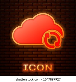 Glowing neon Cloud sync refresh icon isolated on brick wall background. Cloud and arrows.  Vector Illustration
