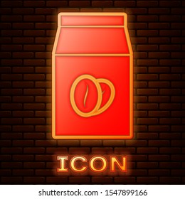 Glowing neon Coffee beans in bag icon isolated on brick wall background.  Vector Illustration
