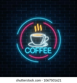 Glowing neon coffee cup icon in circle frames. Light effect hot beverage or cafe sign.