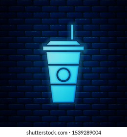 Glowing neon Coffee cup icon isolated on brick wall background. Disposable coffee cup with hot coffee.  Vector Illustration