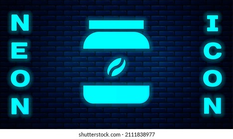 Glowing neon Coffee jar bottle icon isolated on brick wall background.  Vector Illustration