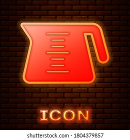 Glowing neon Coffee pot icon isolated on brick wall background. Vector.