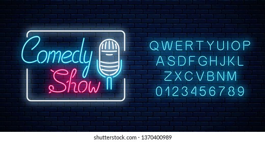 Glowing neon comedy show sign with retro microphone in rectangle frame with alphabet on a brick wall background. Humor monolog glowing signboard. Vector illustration.