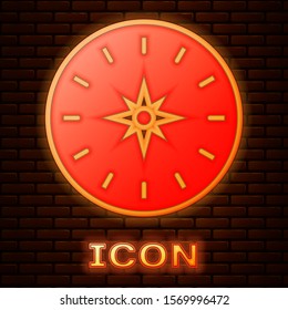 Glowing neon Compass icon isolated on brick wall background. Windrose navigation symbol. Wind rose sign.  Vector Illustration