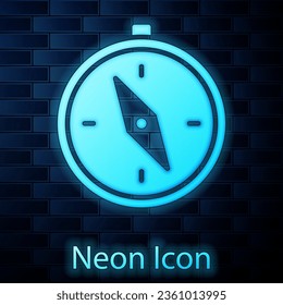 Glowing neon Compass icon isolated on brick wall background. Windrose navigation symbol. Wind rose sign.  Vector Illustration