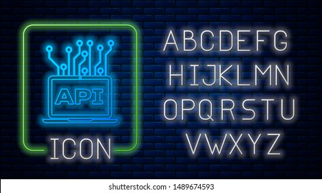 Glowing neon Computer api interface icon isolated on brick wall background. Application programming interface API technology. Software integration. Neon light alphabet. Vector Illustration