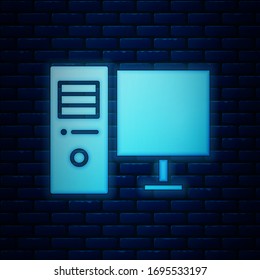Glowing neon Computer monitor icon isolated on brick wall background. PC component sign.  Vector Illustration