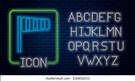 Glowing neon Cone meteorology windsock wind vane icon isolated on brick wall background. Windsock indicate the direction and strength of the wind. Neon light alphabet. Vector Illustration