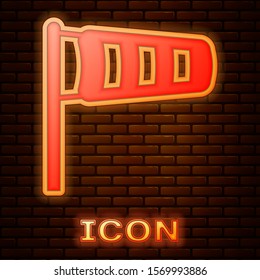 Glowing neon Cone meteorology windsock wind vane icon isolated on brick wall background. Windsock indicate the direction and strength of the wind.  Vector Illustration