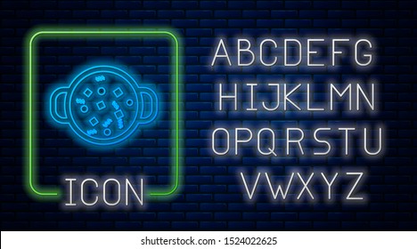 Glowing neon Cooking soup in pot icon isolated on brick wall background. Boil or stew food symbol. Neon light alphabet. Vector Illustration