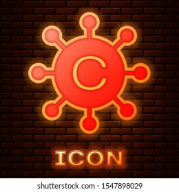 Glowing neon Copywriting network icon isolated on brick wall background. Content networking symbol. Copyright sign. Copywriting network sign.  Vector Illustration