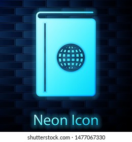 Glowing neon Cover book travel guide icon isolated on brick wall background.  Vector Illustration