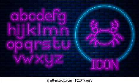 Glowing neon Crab icon isolated on brick wall background. Neon light alphabet. Vector Illustration