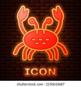 Glowing neon Crab icon isolated on brick wall background. Vector
