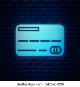 Glowing neon Credit card icon isolated on brick wall background. Online payment. Cash withdrawal. Financial operations. Shopping sign.  Vector Illustration