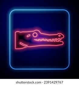 Glowing neon Crocodile icon isolated on blue background. Animal symbol.  Vector
