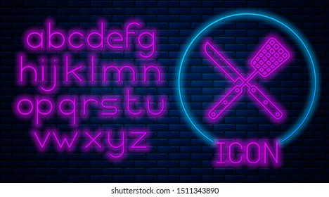 Glowing neon Crossed knife and spatula icon isolated on brick wall background. BBQ knife and spatula sign. Barbecue and grill tools. Neon light alphabet. Vector Illustration