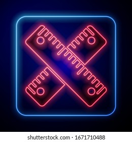 Glowing neon Crossed ruler icon isolated on blue background. Straightedge symbol.  Vector Illustration