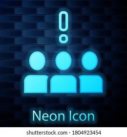 Glowing neon Crowd protest icon isolated on brick wall background. Demonstration. Vector.