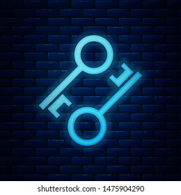 Glowing neon Cryptocurrency key icon isolated on brick wall background. Concept of cyber security or private key, digital key with technology interface.  Vector Illustration