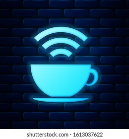 Glowing neon Cup of coffee shop with free wifi zone icon isolated on brick wall background. Internet connection placard.  Vector Illustration