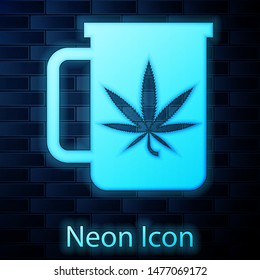 Glowing neon Cup tea with marijuana or cannabis leaf icon isolated on brick wall background. Marijuana legalization. Hemp symbol.  Vector Illustration