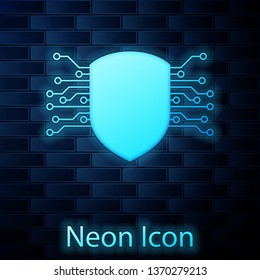 Glowing neon Cyber security icon isolated on brick wall background. Shield sign. Safety concept. Digital data protection. Vector Illustration