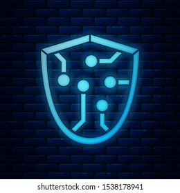 Glowing neon Cyber security icon isolated on brick wall background. Shield sign. Safety concept. Digital data protection.  Vector Illustration