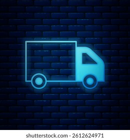 Glowing neon Delivery cargo truck vehicle icon isolated on brick wall background.  Vector