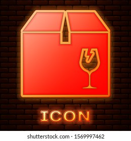 Glowing neon Delivery package box with fragile content symbol of broken glass icon isolated on brick wall background. Box, package, parcel sign.  Vector Illustration