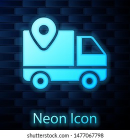 Glowing neon Delivery tracking icon isolated on brick wall background. Parcel tracking.  Vector Illustration