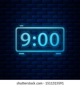 Glowing neon Digital alarm clock icon isolated on brick wall background. Electronic watch alarm clock. Time icon.  Vector Illustration