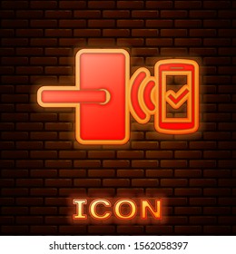 Glowing neon Digital door lock with wireless technology for unlock icon isolated on brick wall background. Door handle sign. Security smart home.  Vector Illustration
