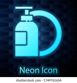 Glowing neon Dishwashing liquid bottle and plate icon isolated on brick wall background. Liquid detergent for washing dishes. Vector Illustration