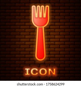 Glowing neon Disposable plastic fork icon isolated on brick wall background. Vector Illustration