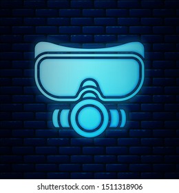 Glowing neon Diving mask icon isolated on brick wall background. Extreme sport. Sport equipment.  Vector Illustration